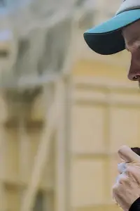 Mark O'Connor - Assistant Director, wears a covert radio ear piece.