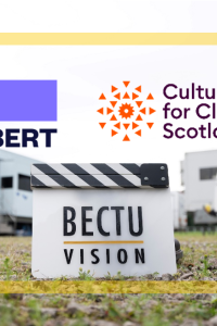 Photo of a unit base with the BECTU Vision Clapper Board, Albert and Culture for Climate Scotland logos