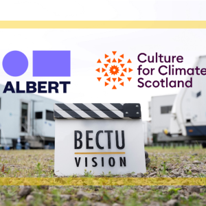 Photo of a unit base with the BECTU Vision Clapper Board, Albert and Culture for Climate Scotland logos